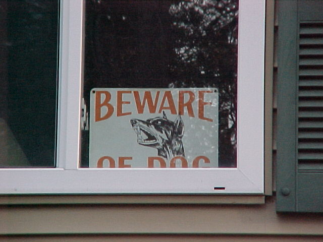 Beware of dog sign in window