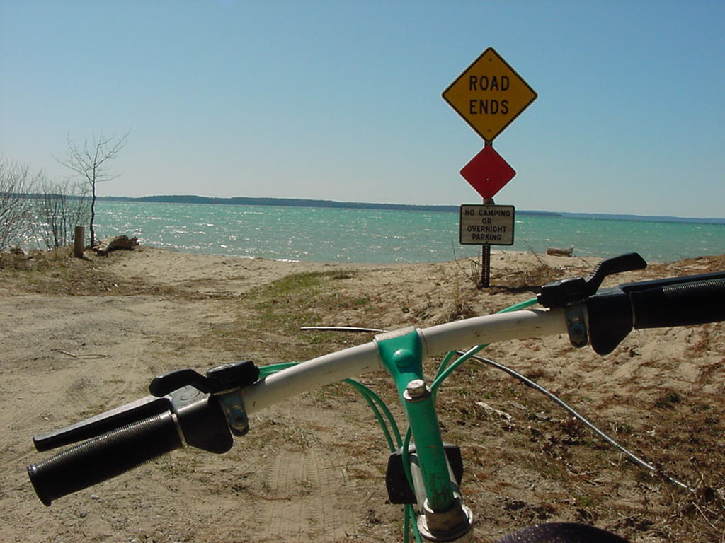 Bike at end of road viewing lake