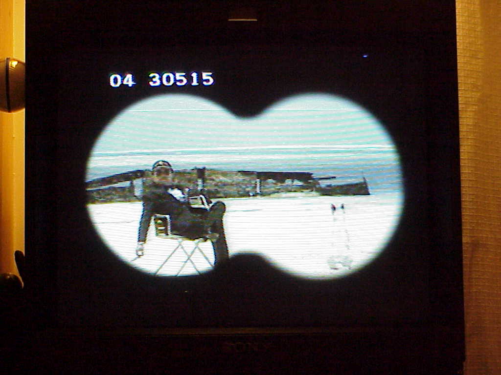 binoculars at guy