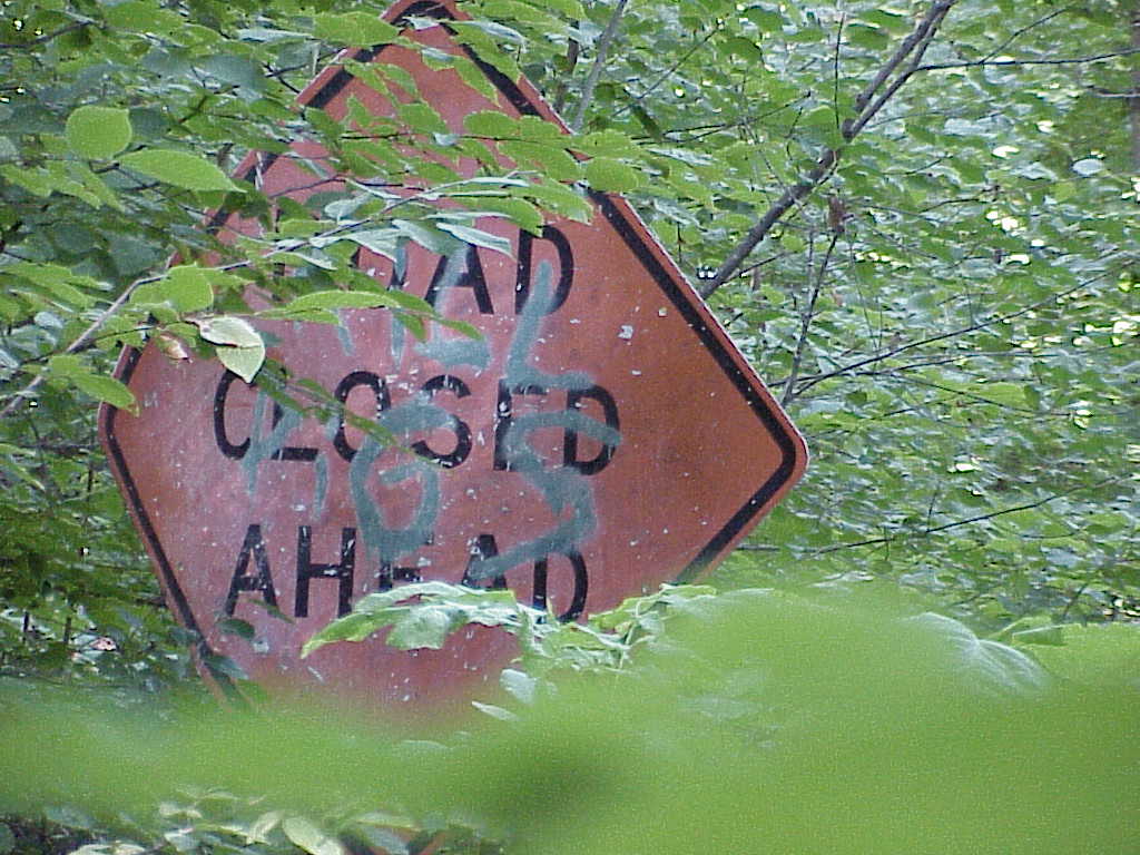 Road closed ahead sign