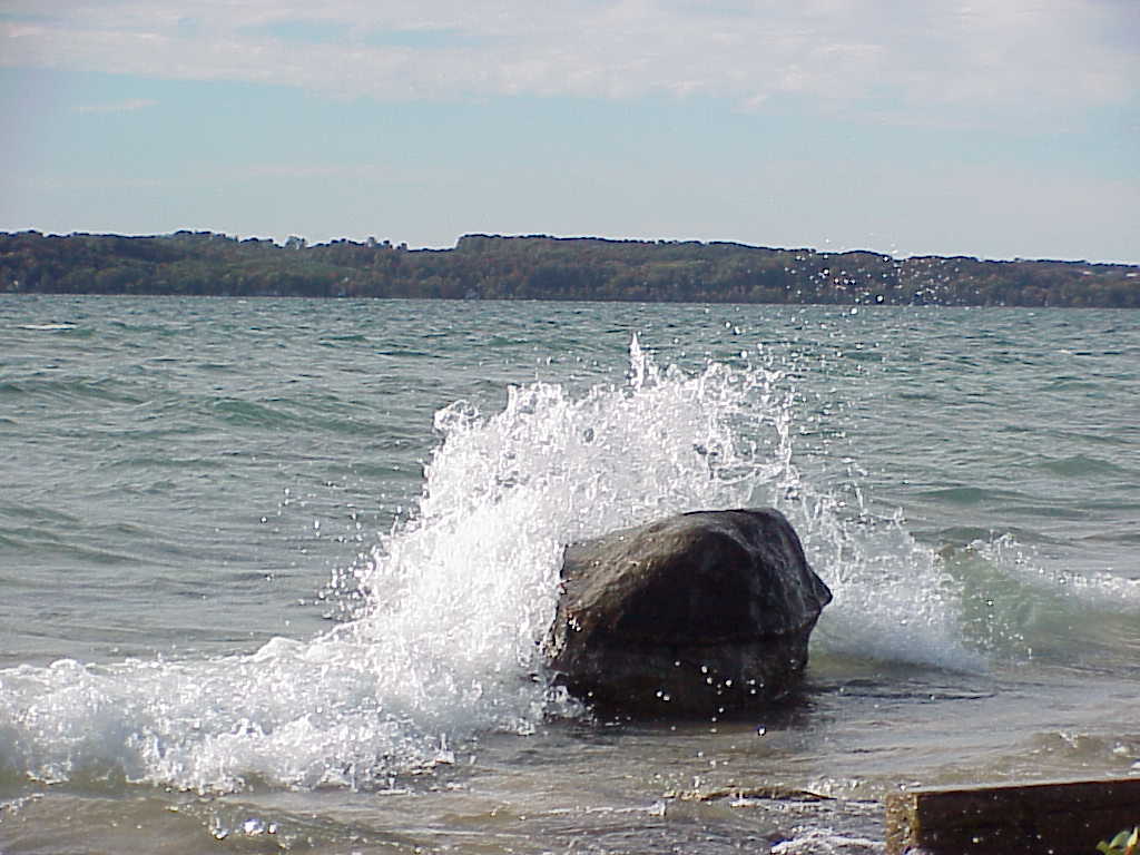 Water splashing over rock